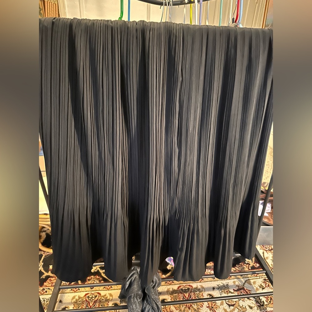 Long black skirt with rippled design